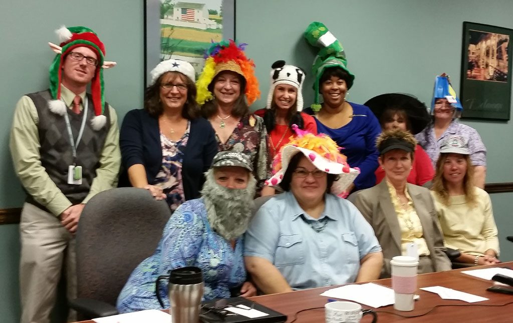 Photo of Employees wearing silly hats for Crazy Hat Day