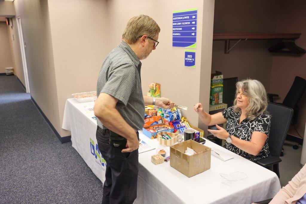 One person purchasing bake sale items